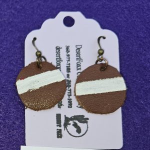 Approximately 1 3/8 inch hand painted round leather earrings with brown and white.