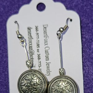 Approximately 2 1/8 inch round silver findings with designs and silver beads with stainless steel ear wires.