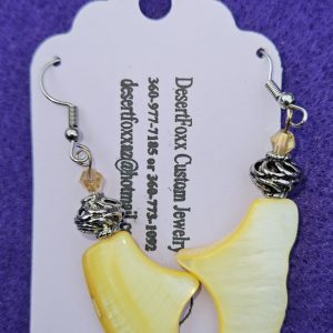 Approximately 1½ inch plastic yellow beads with silver findings stainless steel wires and yellow crystals.