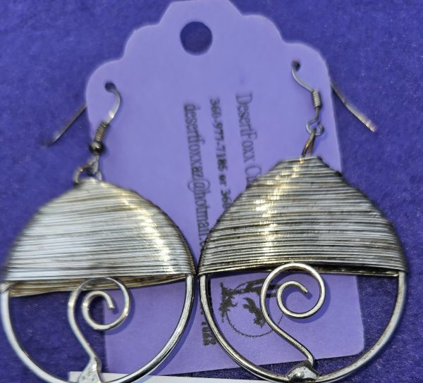 Approximately 1 ½ inch round silver stainless steel wire wrapped with stainless steel ear wires.