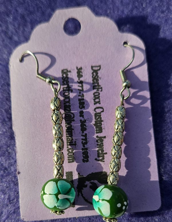 Hand painted green beads with half inch silver long beads total length 2 inches long with stainless steel wires.