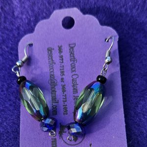 One sixteenth wide opulent purple and green see-through beads 2 inches long with crystal beads to the end.