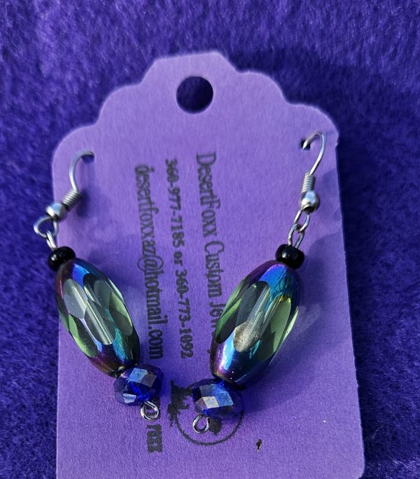 One sixteenth wide opulent purple and green see-through beads 2 inches long with crystal beads to the end.