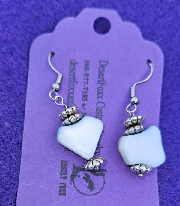 Approximately 1 1/2 inch two blue and white beads with silver findings with stainless steel ear wires.