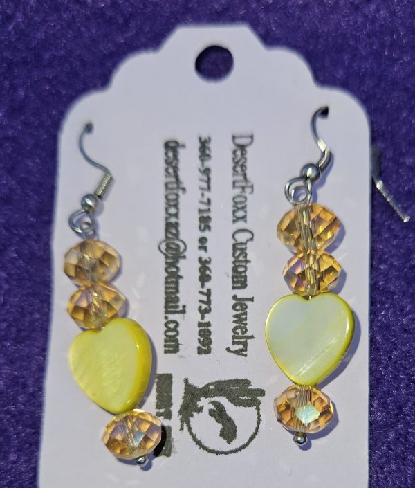 Approximately 2 inches, yellow heart beads with crystals and stainless steel ear wires.