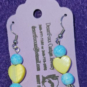 Approximately 2 inches yellow heart beads with two round beads turquoise in color with silver finish findings and stainless steel ear wires.