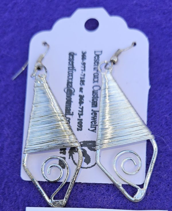 Approximately 2 1/2 inches silver wire wrapped earrings with stainless steel wires.