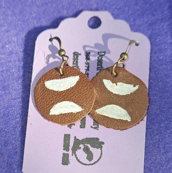 Approximately 1 inch round leather with hand painted half moons and bronze ear wires.