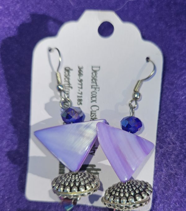 Approximately 2 inches long, purple triangles with flat silver findings and purple crystals with stainless steel ear wires.