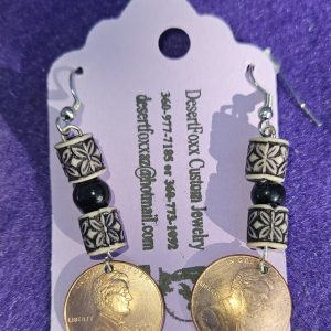 Approximately 2 1/4 inches long copper penny domed with tan and black beads, round black beads, and silver stainless steel ear wires.