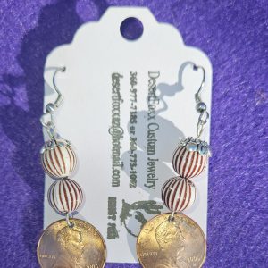 Approximately 2 inches length Domed copper penny with white and brown striped beads, a silver finding and ear wires.