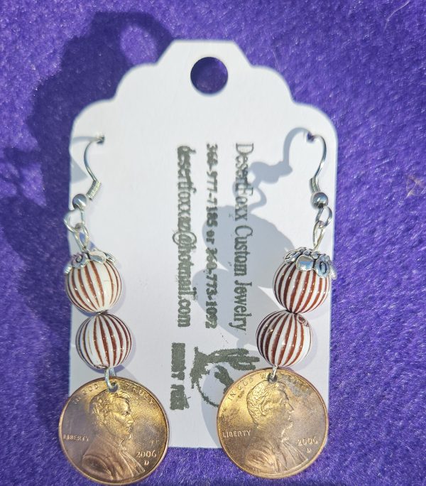 Approximately 2 inches length Domed copper penny with white and brown striped beads, a silver finding and ear wires.