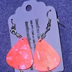 Approximately 2 inches Fluorescent pink guitar pick earrings with silver findings and ear wires.