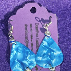 Approximately 2 inches Fluorescent blue guitar pick earrings with silver findings and ear wires.