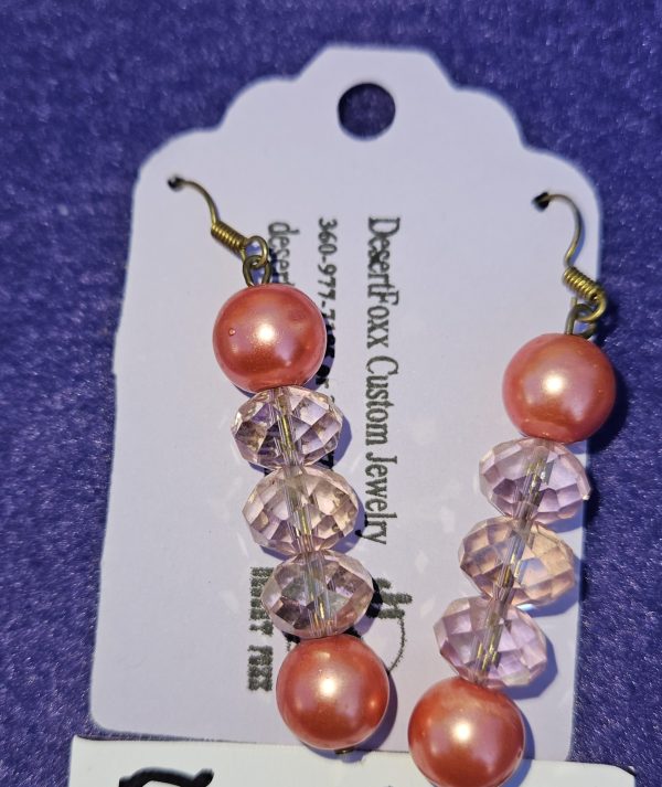 Approximately 2 inches long. Salmon pink simulated pearls with pink pink crystals