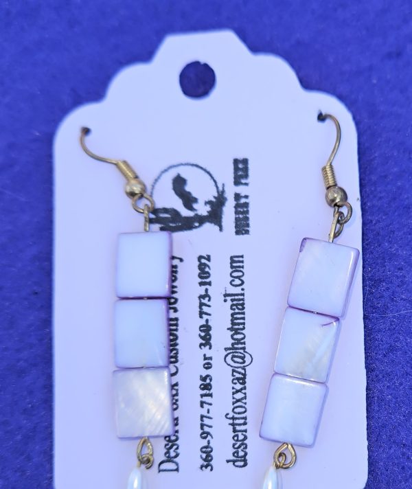 Approximately 2 3/8 inches long. Two-toned square beads that are white with purple sides and white simulated pearls.