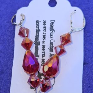 Approximately 2 3/8 inches long. Five red crystals with closed ear wires.