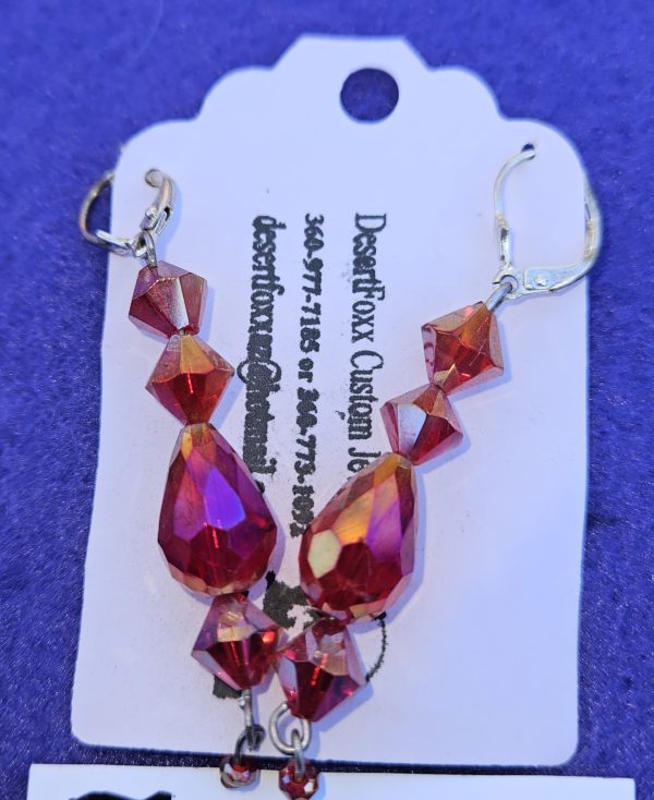 Approximately 2 3/8 inches long. Five red crystals with closed ear wires.