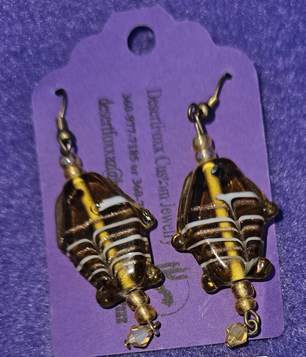 Approximately 2 1/2 inches long. Gold see-through fish with gold crystals.