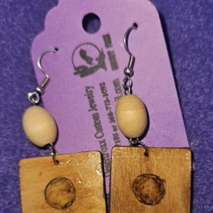 Approximately 2 1/2 inches long. Wooden squares with wood burned designs and wooden beads.