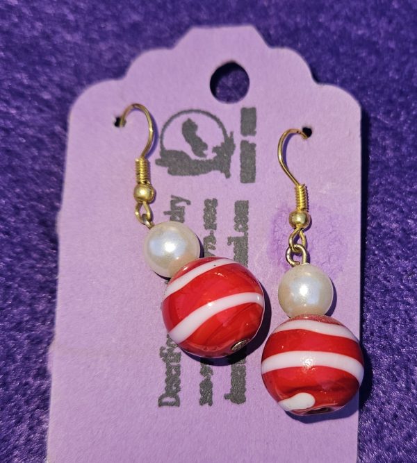 Approximately 1 1/2 inch long. Large red and white beads with white simulated pearls.