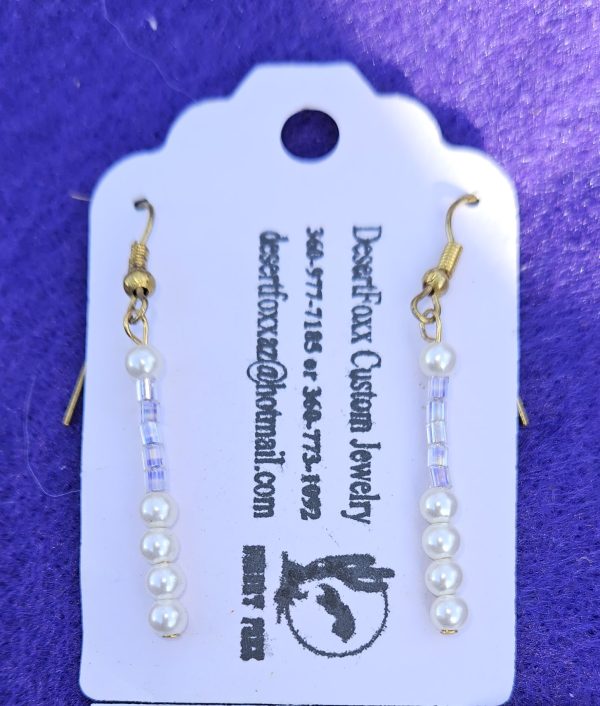 Approximately 1 5/8 inch long. Clear white crystal beads with simulated pearls.