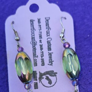 Approximately 2 inches long. Clear opulent beads that change colors with crystal beads and stainless ear wires.