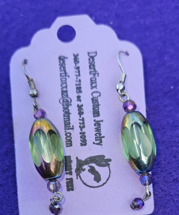 Approximately 2 inches long. Clear opulent beads that change colors with crystal beads and stainless ear wires.