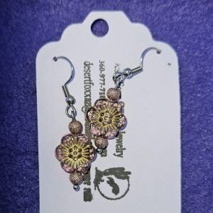 Approximately 1 3/8 inch long. Clear violet beads with gold designs and gold brocade floweret and stainless ear wires.