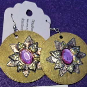 Approximately 2 inches long. Gold wooden disks with flower design and stainless ear wires.