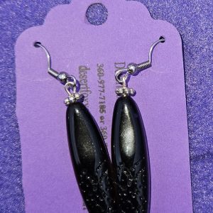 Approximately 2 1/8 inches long. Black beads with textured designs, silver finding, and stainless ear wires.