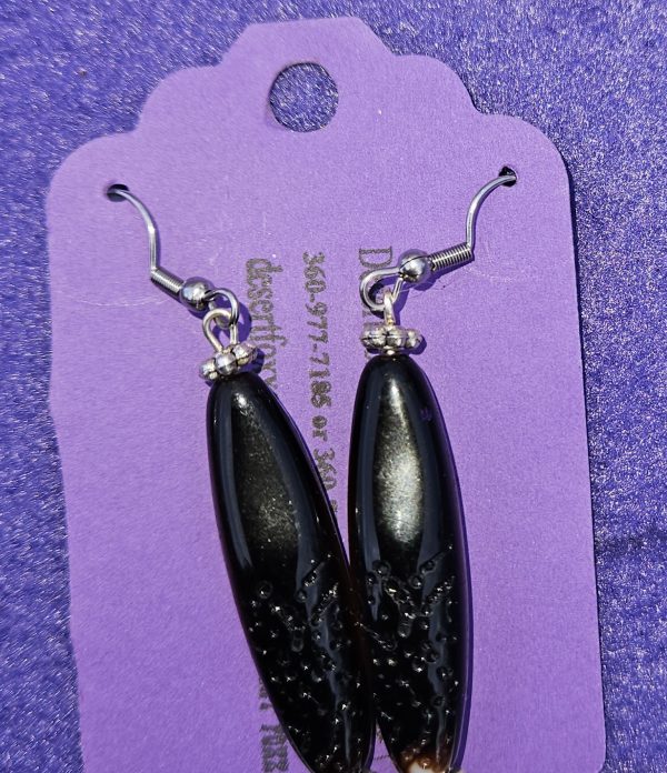 Approximately 2 1/8 inches long. Black beads with textured designs, silver finding, and stainless ear wires.