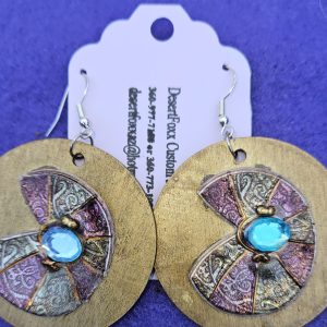 Approximately 2 inches long. Gold two inch wooden disks with stamps and mod-podge,