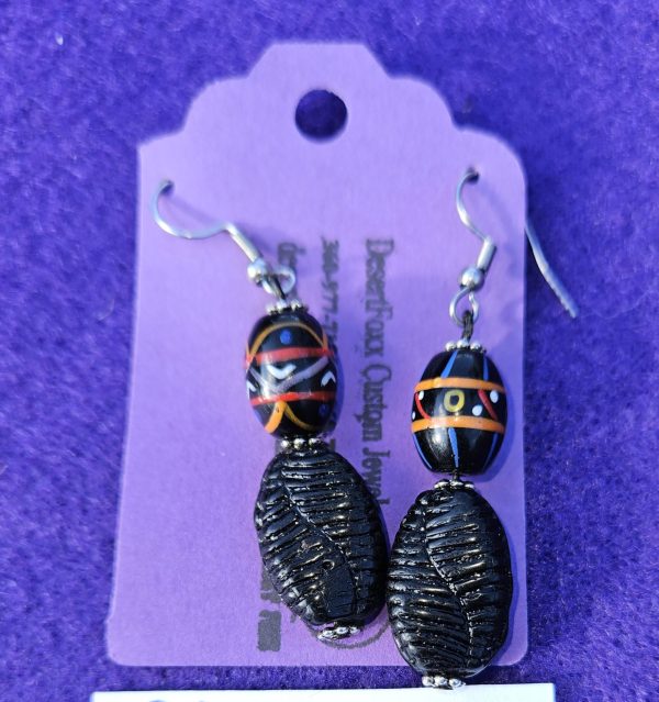 Approximately 2 1/4 inches with black textured beads with painted beads, silver findings, and stainless steel ear wires.