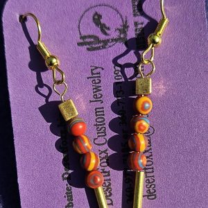Aprox. 1 1/8 inch Orange and Blue/Yellow swirled 4 mm. beads with Gold findings and Gold ear wires.