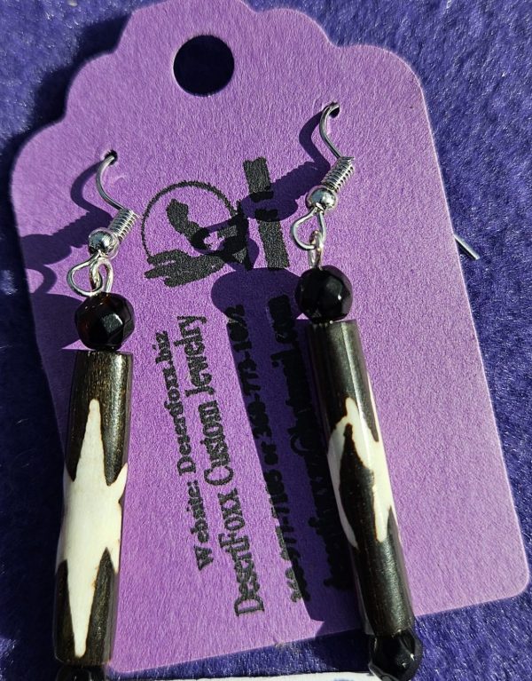 Approx. 2 3/8 inches, Long Brown Beads with Tan designs topped off with black round beads and silver colored ear wires.