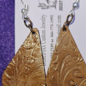 Approx. 2 ¼ inches, Brown tooled Leather tear drop earrings with gold colored ear wires. $21.99