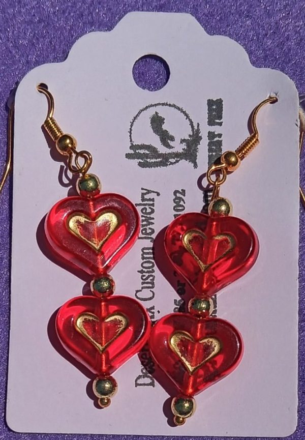 Approx. 2 inches, Red clear beads with gold heart designs with gold ear wires.