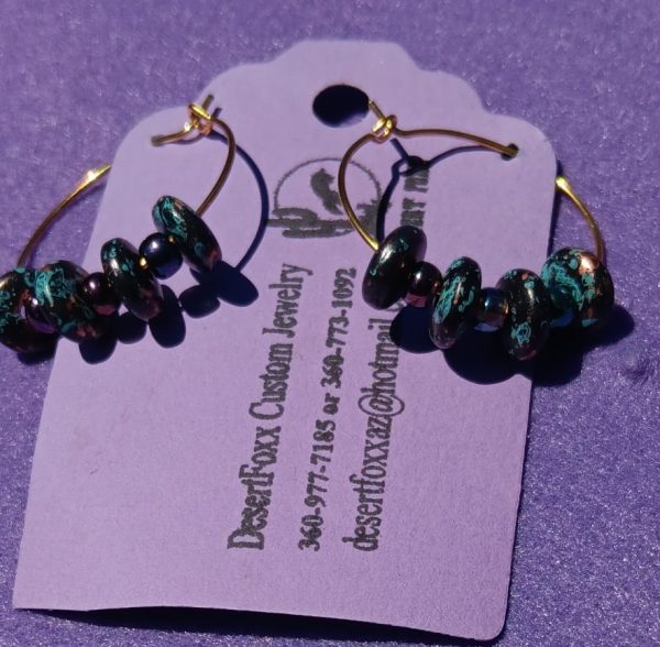 Approx. 1 inch Small round gold hoops with multi colored beads with multi colored spaces.