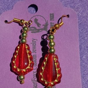 Approx. 1 7/8 inches Red Clear beads trimmed in gold with Gold and Red Beads.