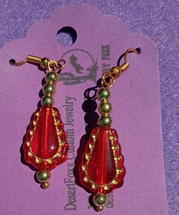Approx. 1 7/8 inches Red Clear beads trimmed in gold with Gold and Red Beads.