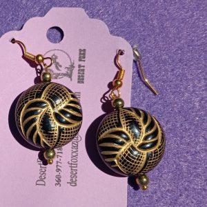 Approx. 2 1/8 inches rounded black raised beads with lamae of gold details with gold beads.