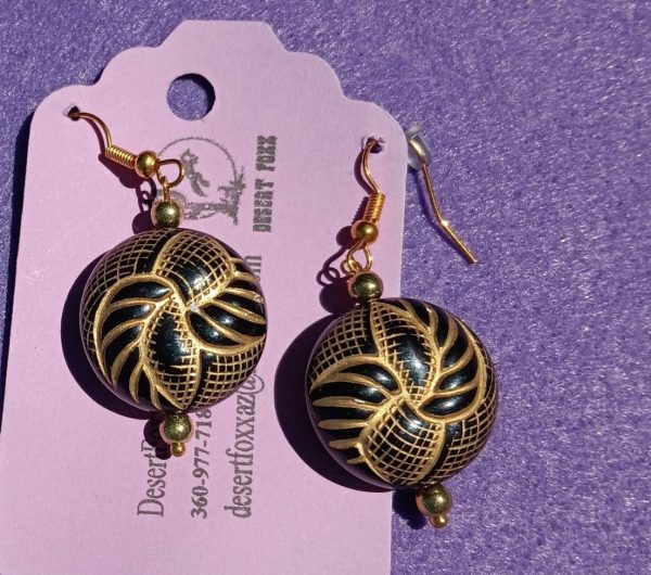 Approx. 2 1/8 inches rounded black raised beads with lamae of gold details with gold beads.