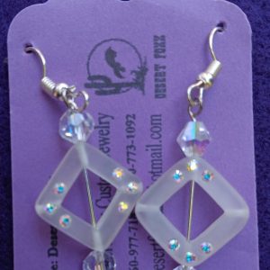 Approx. 1 1/2 inches Clear see-through square beads with white crystals and round clear beads with silver finishings.