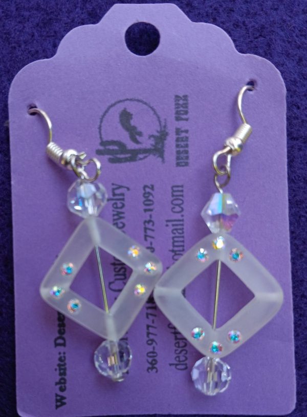 Approx. 1 1/2 inches Clear see-through square beads with white crystals and round clear beads with silver finishings.