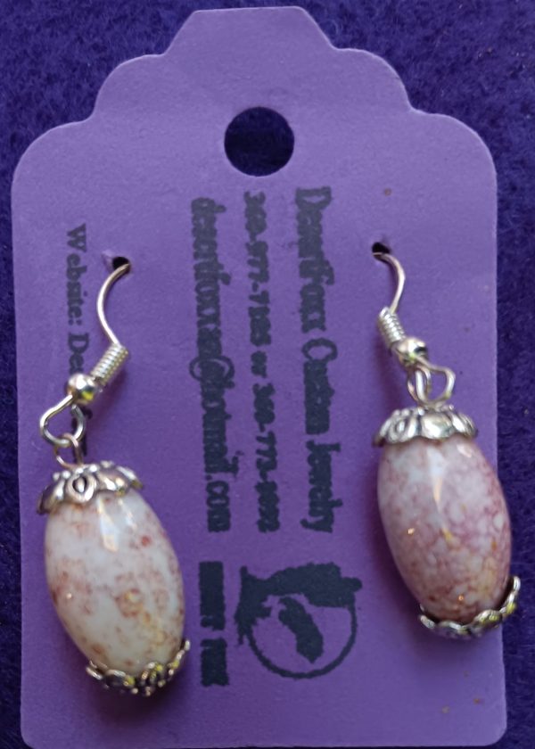 Approx. 1 3/8 inches Egg shaped pinkish beads with silver findings.