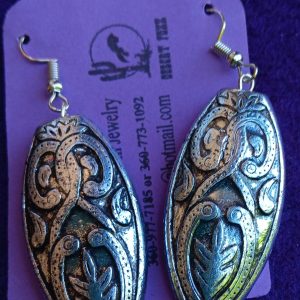 Approx. 2 1/8 inches Silver Egg shaped with silver and black brocaid with silver findings.
