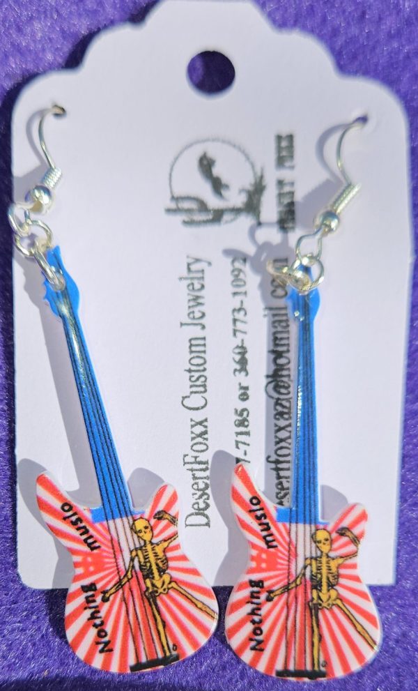 Approx. 2 5/8 inches Plastic Guitar multicolored with silver ear wires. 21.99