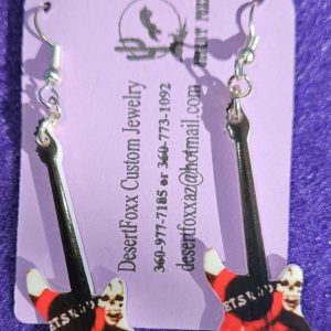 Approx. 2 5/8 inches, Plastic guitar with red, black, and white design with silver ear wires. 21.99