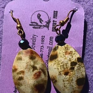Approx. 2 inches, Marquise shaped bead with black/tan/green design with silver findings and gold earwires and black beads.